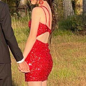 Perfect condition. Sparkly red homecoming dress. Comes w/ earrings if you’d like